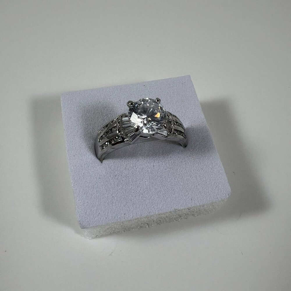 Silver Tone Engagement Ring With Round Glass Stone & Intricate Band Detailing